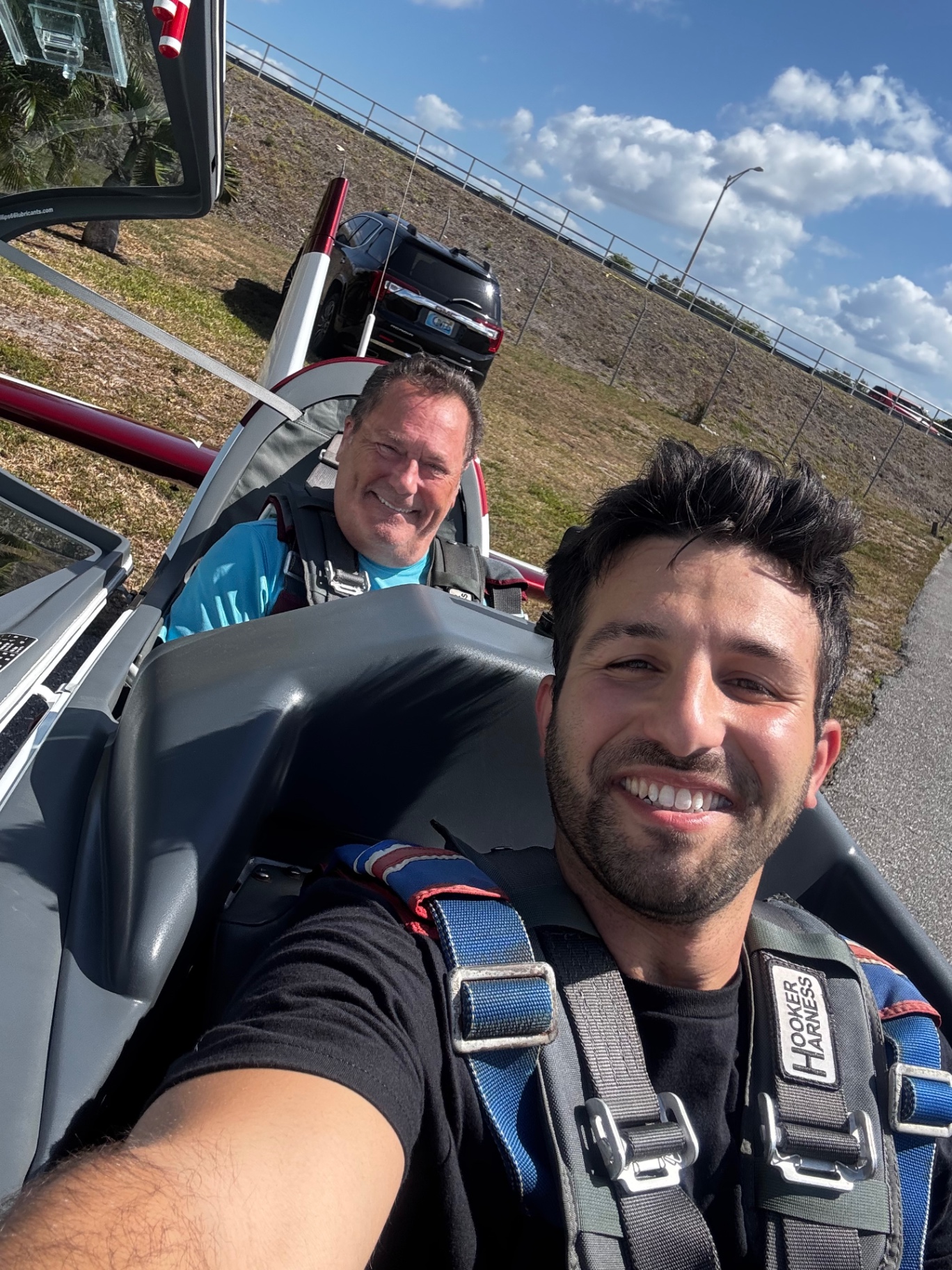 Instructor and student strapped into the Extra 330 before a training flight